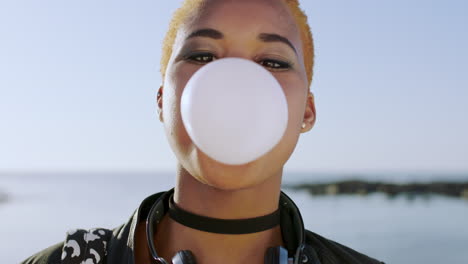 Funny,-face-and-bubble-gum-with-black-woman