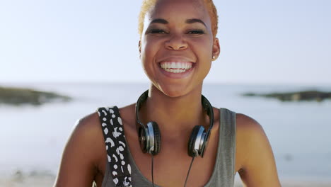 Beach,-face-and-headphones-of-black-woman