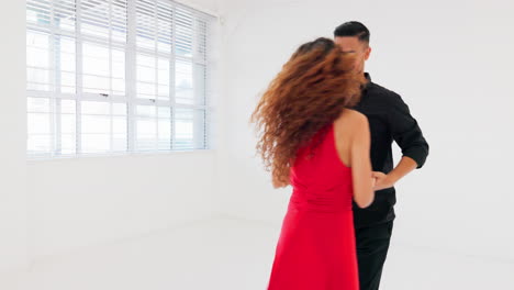 Couple,-bonding-and-ballroom-dancing-in-studio