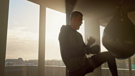 Man,-kickboxing-or-punching-bag-in-fitness
