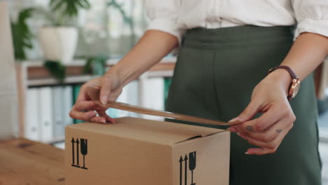 Woman-designer,-box-and-tape-for-delivery