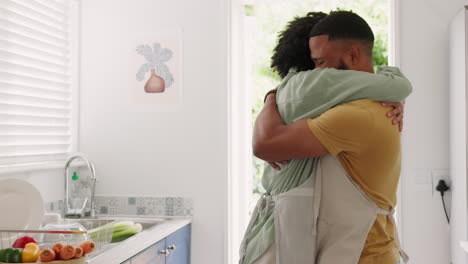Couple,-kitchen-and-hug-of-a-young-marriage