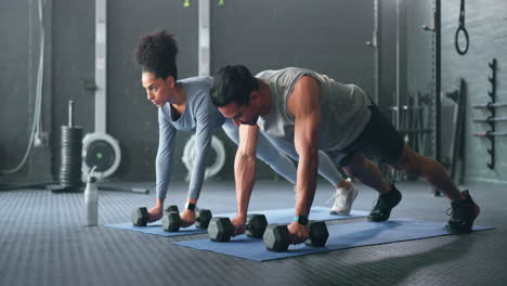 Fitness,-gym-and-couple-plank-with-weight-dumbbell