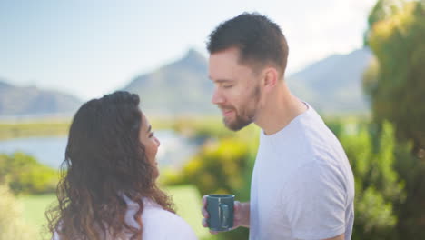 Couple,-vacation-and-kiss-with-coffee-in-morning