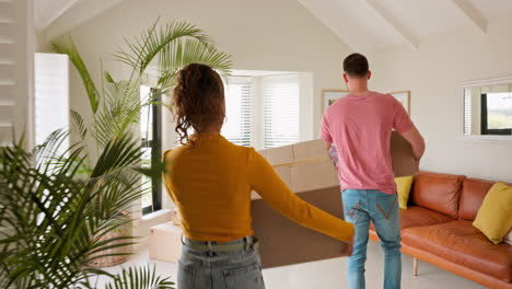 Property,-moving-and-couple-with-box-for-new-home