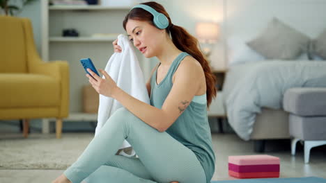 Woman,-phone-and-yoga-with-rest