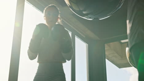 Boxing,-punching-bag-and-gym-woman-with-personal