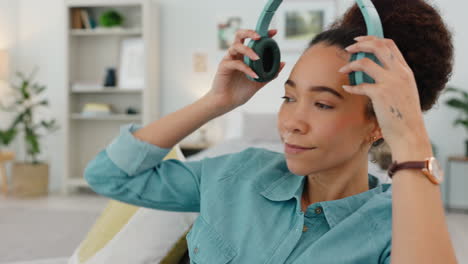 Music,-headphones-and-woman-dance-on-sofa-in-home