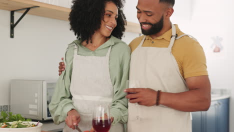 Love,-black-couple-and-drinking-wine-while-cooking