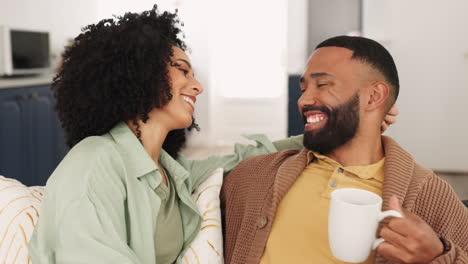 Black-couple,-smile-and-relax-on-sofa-together