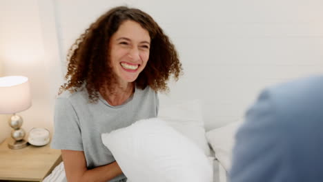 Pillow-fight,-happy-couple-and-bedroom-play