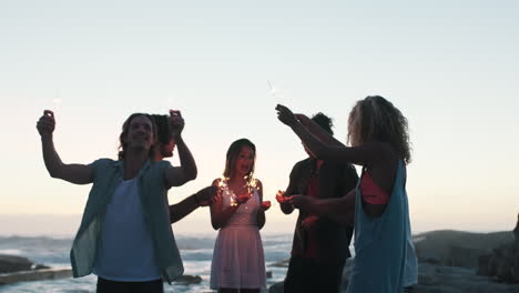 Friends-group,-beach-and-sparklers