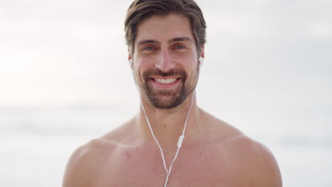 Happy-man,-face-and-beach-while-listening-to-music