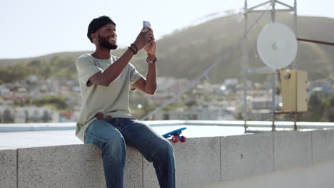 Smartphone,-selfie-and-black-man-on-rooftop