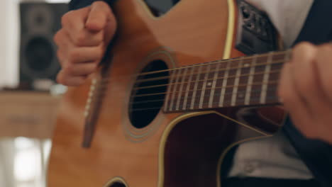Hands,-musician-and-playing-acoustic-guitar