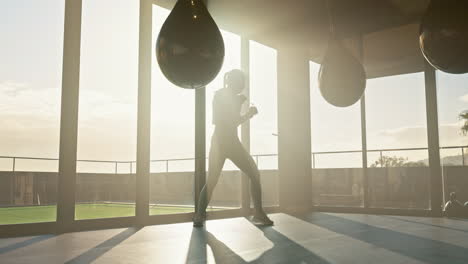 Fitness,-boxing-and-woman-training-with-a-punching