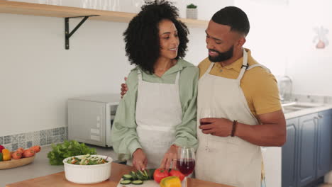 Black-couple,-talking-and-cooking-in-kitchen