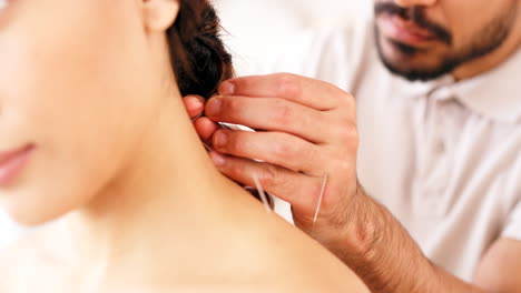 Acupuncture-needle,-spa-and-wellness-with-woman