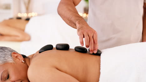 Senior-woman-in-spa,-zen-massage-with-hot-stones