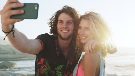 Selfie,-phone-and-happy-couple-at-the-beach