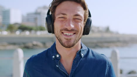 Headphones,-smile-and-face-of-man-at-beach