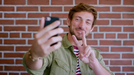 Selfie,-man-and-smartphone-for-peace-sign