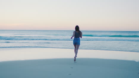 Woman,-running-and-beach-for-sunset