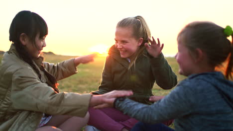 Children,-bonding-or-sunset-hands-game-in-nature