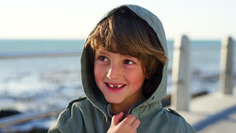 Happy-boy-child,-beach-and-face-with-smile