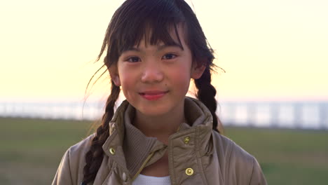 Asian,-little-girl-and-face-at-beach-for-travel