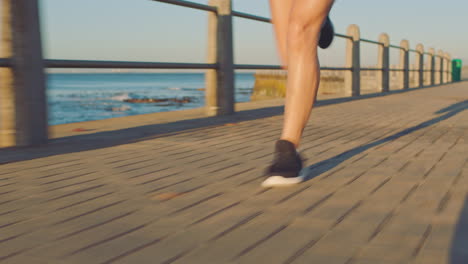Legs,-woman-and-running-for-speed-at-beach