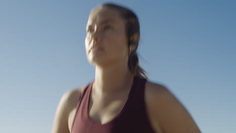 Woman,-running-and-face-of-an-athlete-outside