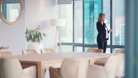 Woman,-phone-call-and-walking-in-business-office