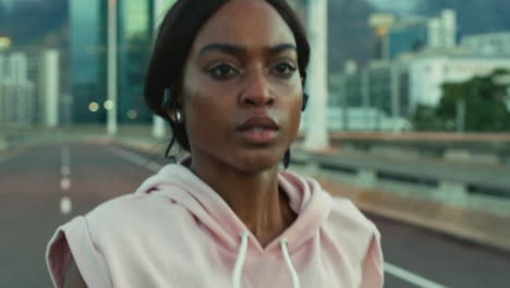 Face,-earphones-or-black-woman-in-city-running