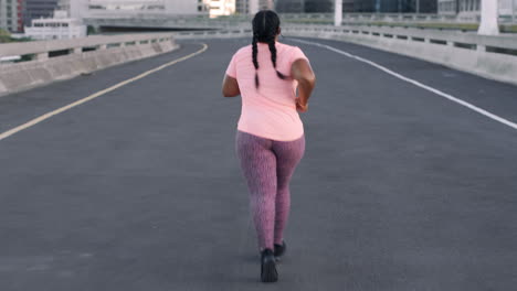Fitness,-freedom-and-black-woman-running-in-city