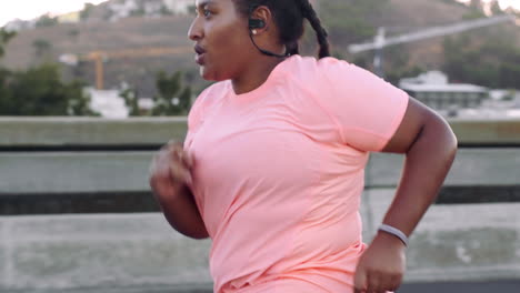 Music,-fitness-and-plus-size-woman-running