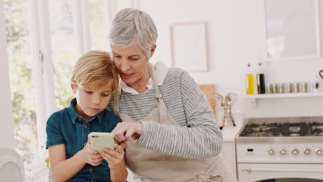Smartphone,-kitchen-and-grandma-with-child