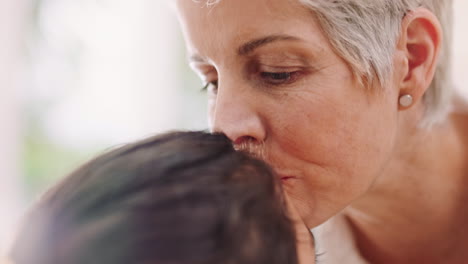 Family,-love-and-grandmother-kiss-girl-on-forehead