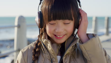 Beach,-headphones-or-child-streaming-music