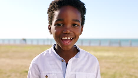 Black-african-boy,-face-and-outdoor-park-by-beach