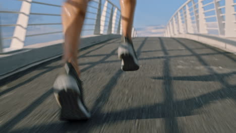 Fitness,-city-and-legs-running-on-a-bridge