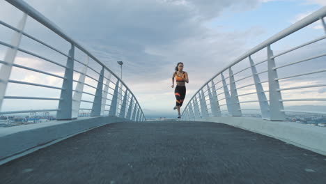 City,-bridge-and-fitness,-woman-running