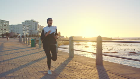 Muslim,-woman-and-sunset-running-at-beach