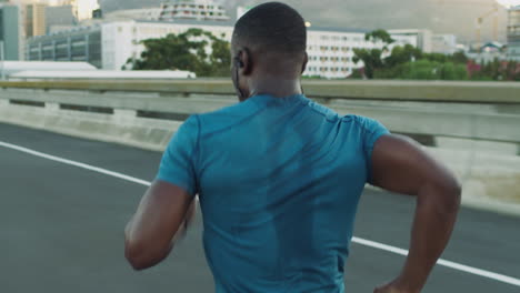 City,-fitness-or-black-man-running-on-road