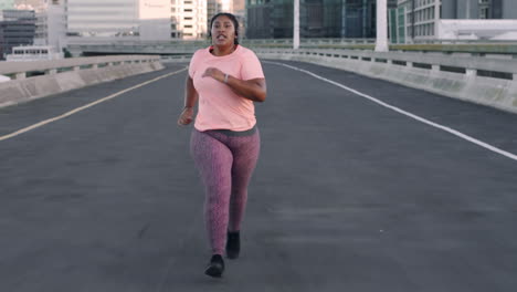 Fitness,-music-and-plus-size-woman-running-in-road