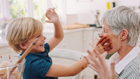 Playful,-messy-and-child-with-grandmother-baking