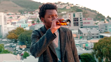 Black-man,-rooftop-sunset-or-drinking-beer-on-city