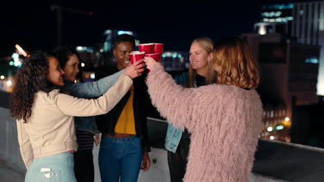 Rooftop,-cheers-and-woman-with-friends-at-a-party
