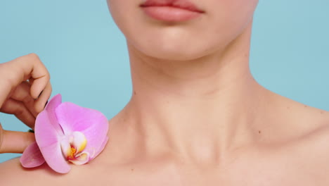 Woman,-orchid-flowers-and-body-for-skincare