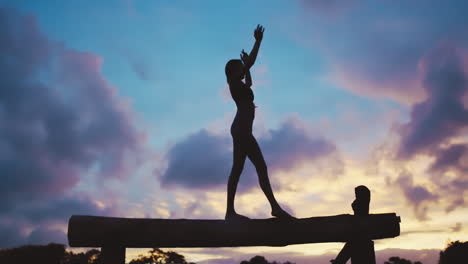 Fitness,-silhouette-and-woman-on-balance-beam